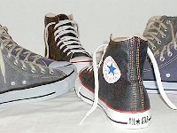 Denim Chuck Taylors  Wheel of denim high tops, including black, blue, and coated navy blue.