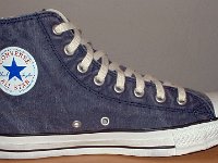 Distressed High Top Chucks  Inside patch view of a left navy blue distressed high top chuck.
