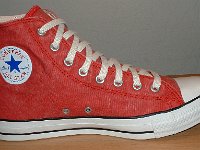 Distressed Red High Top Chucks  Distressed red left high top, inside patch view.