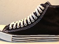 Double Details High Top Chucks  Outside view of a left black double details high top.