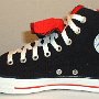 Double Tongue High Top Chucks  Inside patch view of a right black and red double tongue high top.