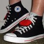 Double Tongue High Top Chucks  Wearing black and red double tongue high tops, angled side view.
