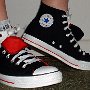 Double Tongue High Top Chucks  Wearing black and red double tongue high tops, side view.