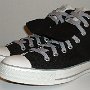 Double Tongue High Top Chucks  Angled side view of black and gray double tongue high tops with gray shoelaces.