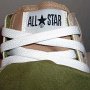 Double Tongue High Top Chucks  Closeup view of the inner tongue and all star label on tan and olive double tongue high tops.