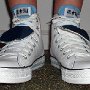 Double Tongue High Top Chucks  Wearing white and blue double tongue high tops, front view 1.