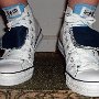 Double Tongue High Top Chucks  Stepping up in white and blue double tongue high tops, front view.