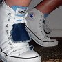Double Tongue High Top Chucks  Stepping out in white and blue double tongue high tops, side view.