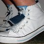 Double Tongue High Top Chucks  Stepping up in white and blue double tongue high tops, side view.