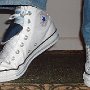 Double Tongue High Top Chucks  Stepping out in white and blue double tongue high tops, angled front view.