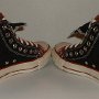Double Upper High Top Chucks  Angled rear view of black and brick red double upper high tops.