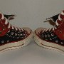 Double Upper High Top Chucks  Angled rear view of folded down black and brick red double upper high tops.