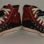 Double Upper High Top Chucks  Angled front view of folded down black and brick red double upper high tops.