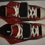 Double Upper High Top Chucks  Top view of folded down black and brick red double upper high tops.