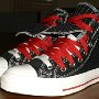Double Upper High Top Chucks  Angled side view of black, red, and milk double upper high tops, with the outer upper rolled down.