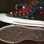 Double Upper High Top Chucks  Inside patch and sole views of black, red, and milk double upper high tops, with the outer uppers rolled down.