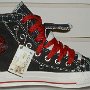 Double Upper High Top Chucks  Inside patch view of a left black, red, and milk double upper high top, new with tag.