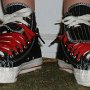 Double Upper High Top Chucks  Wearing black, red, and milk double upper high tops, with the outer uppers rolled down, front view.