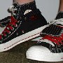Double Upper High Top Chucks  Wearing black, red, and milk double upper high tops, with the outer uppers rolled down, side view.