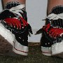 Double Upper High Top Chucks  Wearing black, red, and milk double upper high tops, with the outer uppers rolled down, front view.