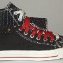 Double Upper High Top Chucks  Outside view of a right black, red, and white double upper high top, with the outer upper rolled down.