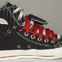 Double Upper High Top Chucks  Inside patch view of a left black, red, and milk double upper high top, with the outer upper rolled down.