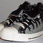 Double Upper High Top Chucks  Angled side view of gray and black double upper high tops, with the outer upper rolled down.