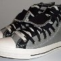 Double Upper High Top Chucks  Angled side view of gray and black double upper high tops.