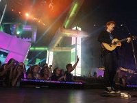 Ed Sheeran  Ed Sheeran singing at a concert.