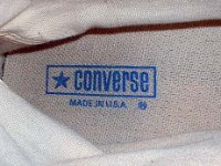 Evolution of the Insole  Closeup of inner sole logo, ankle support and inside canvas of a 1970s black high top.
