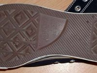 Evolution of the Outer Sole  Close up of the right outer sole from a pair of made in Viet Nam black high tops.
