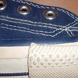 Evolution of the Outer Stitching  Close up of the outer stitching on the right side of a right 1970s navy blue high top.