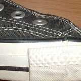 Evolution of the Outer Stitching  Close up of the outer stitching on the right side of a left 1980s black high top.