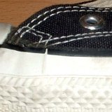 Evolution of the Outer Stitching  Close up of the outer stitching on the left side of a left early 1990s black high top.