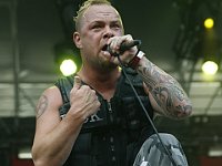 Five Finger Death Punch  Ivan Moody wearing black high top one stars.