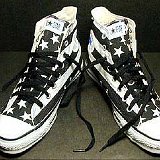 Flag Pattern Chucks  Black and white stars and bars high tops, top view.