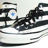 Flag Pattern Chucks  Black and white stars and bars high tops, angled side view.