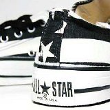 Flag Pattern Chucks  Black and white stars and bars low cut, showing closeup of the heel patch.