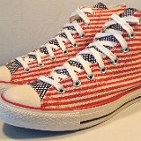 Flag Pattern Chucks  Angled side view of blue flag Americana high top chucks.