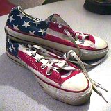 Flag Pattern Chucks  Worn stars and bars low cuts, angled top view.