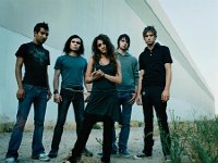 Flyleaf  James Culpepper (right), drummer of Flyleaf wears his chucks to a photo shoot