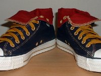 Foldover High Top Chucks  Navy, red, and gold foldovers, angled front view.