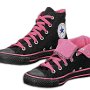 Foldover High Top Chucks  Monochrome black and neon pink foldover high tops, showing the right shoe laced up and rolled down.