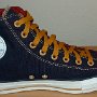 Foldover High Top Chucks  Left navy, red, and gold foldover high top with old gold laces, inside patch view.