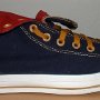 Foldover High Top Chucks  Right navy, red, and gold foldover high tops with old gold laces, rolled down outside view.