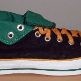 Foldover High Top Chucks  Outside view of a right black, green, amber foldover rolled down to the sixth eyelet.