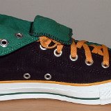 Foldover High Top Chucks  Inside patch view of a left black, green, amber foldover rolled down to the sixth eyelet.