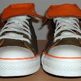 Foldover High Top Chucks  Front view of olive green and orange foldovers rolled down to the sixth eyelet.