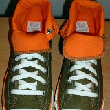 Foldover High Top Chucks  Top view of olive green and orange foldovers rolled down to the sixth eyelet.