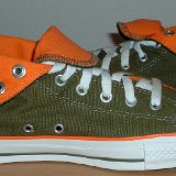Foldover High Top Chucks  Inside patch views of olive green and orange foldovers rolled down to the sixth eyelet.